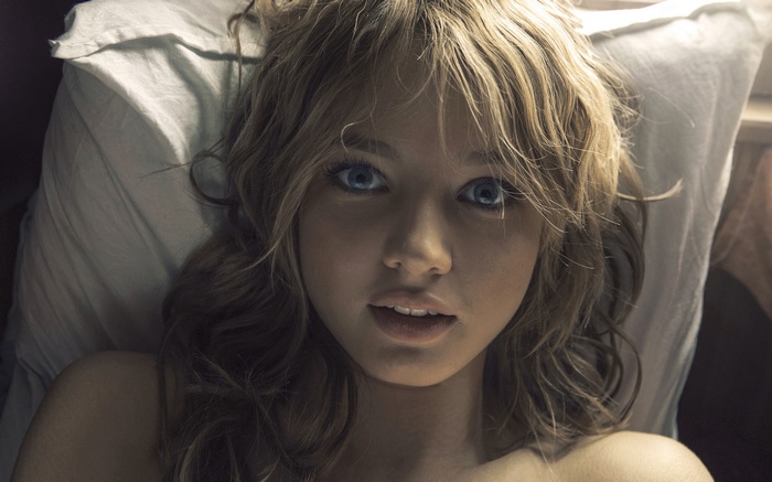 Iren Bauskova with blue eyes and wavy hair