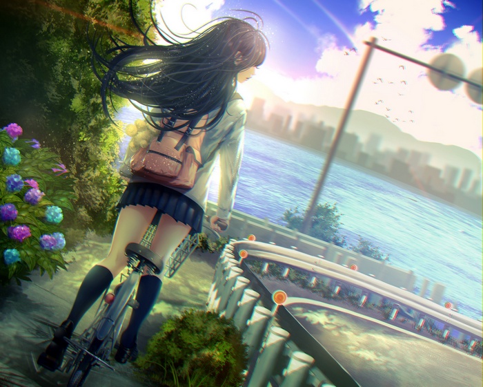 Girl in school uniform riding a bicycle by the river