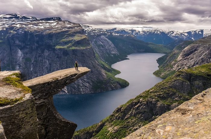 Woman on Trolltunga rock in Norway
