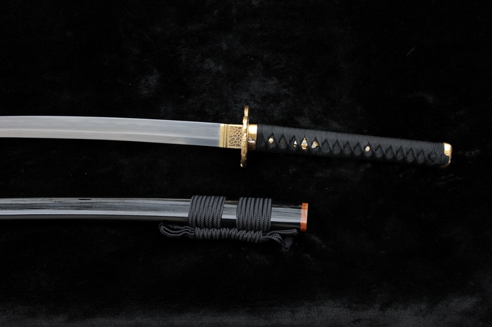 Katana sword with black handle and scabbard