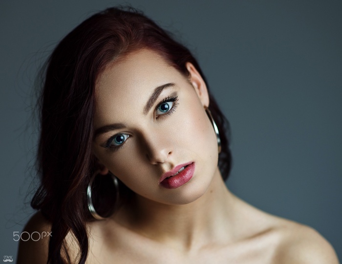 Portrait of a redhead woman with blue eyes