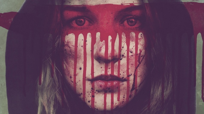 Woman with red paint dripping on her face
