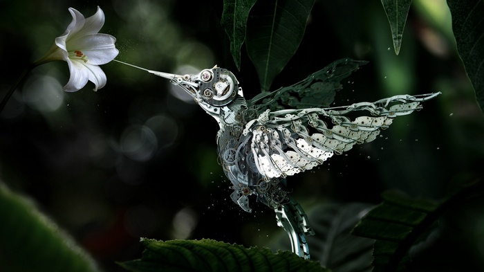 Mechanical hummingbird feeding from a white lily