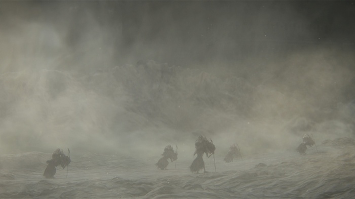 Dark Souls III figures in a foggy, desolate landscape