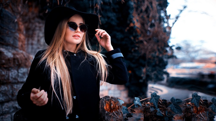 Maria Puchnina wearing a hat and sunglasses outdoors