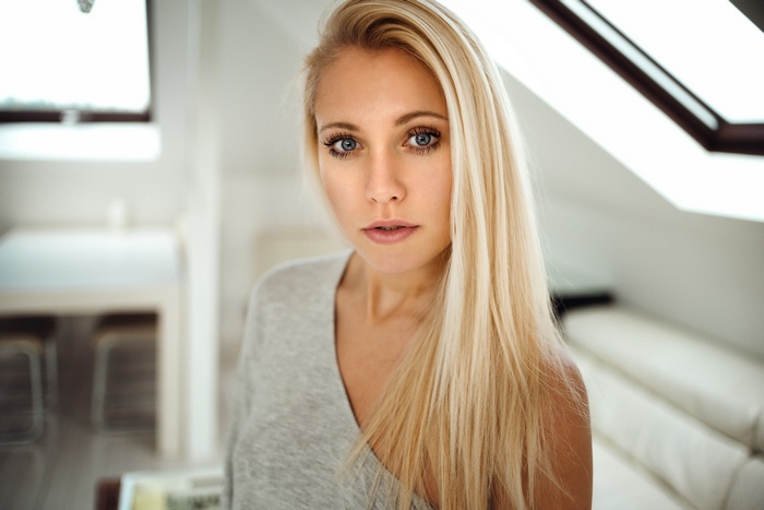 Portrait of a blonde woman with blue eyes by Miro Hofmann