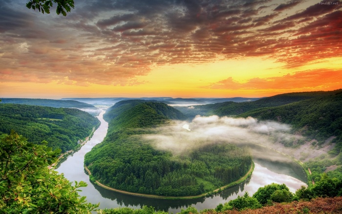 River valley with forest and sunset sky