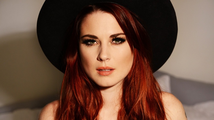 Alexandra Breckenridge wearing a black hat