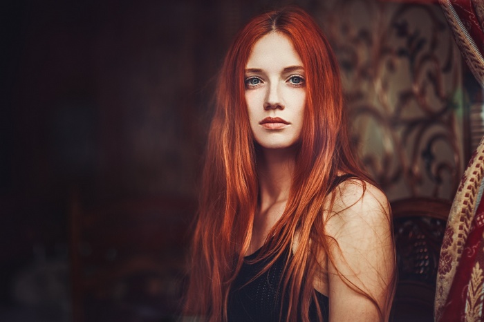 Portrait of a young woman with red hair