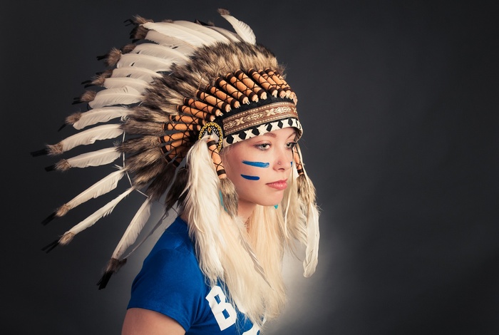 Woman wearing a Native American headdress