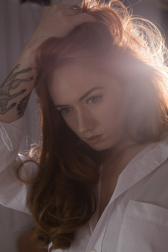 Jenny OSullivan with red hair and tattoo