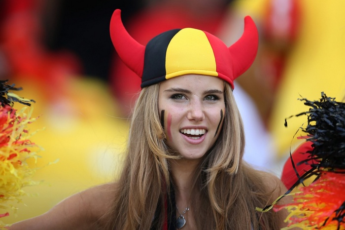 Axelle Despiegelaere wearing a Belgian flag hat and face paint