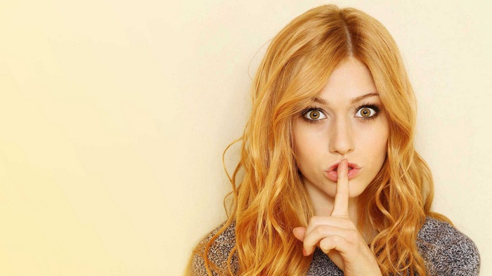 Katherine McNamara with finger on lips