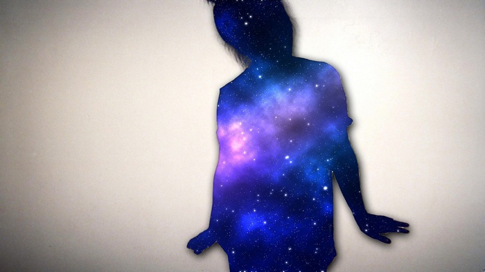 Silhouette of a person filled with a galaxy