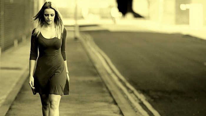 Woman walking down a street