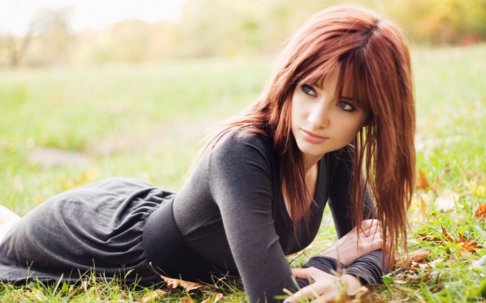 Susan Coffey lying on grass