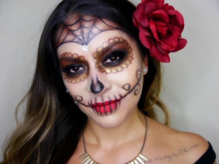 Woman with Sugar Skull makeup and red rose