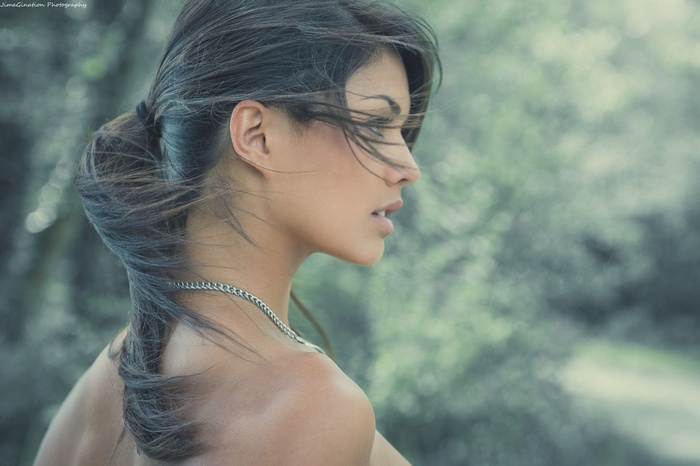 Woman with ponytail outdoors in the wind