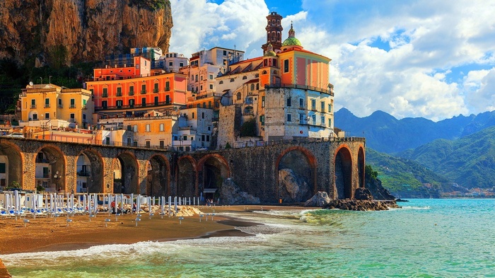 Amalfi Coast town with colorful buildings and a beach