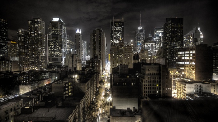 New York City skyline at night with illuminated skyscrapers