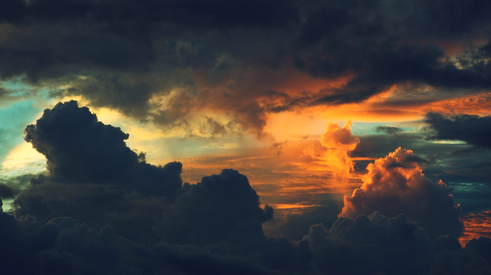 Dramatic sunset clouds with orange and dark tones