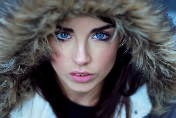 Danielle Sharp with blue eyes in a fur-lined hood