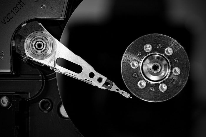 Monochrome close-up of a hard drive's internal components