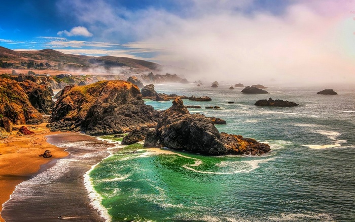 Misty California Coastline with Rocky Beaches and Rolling Hills