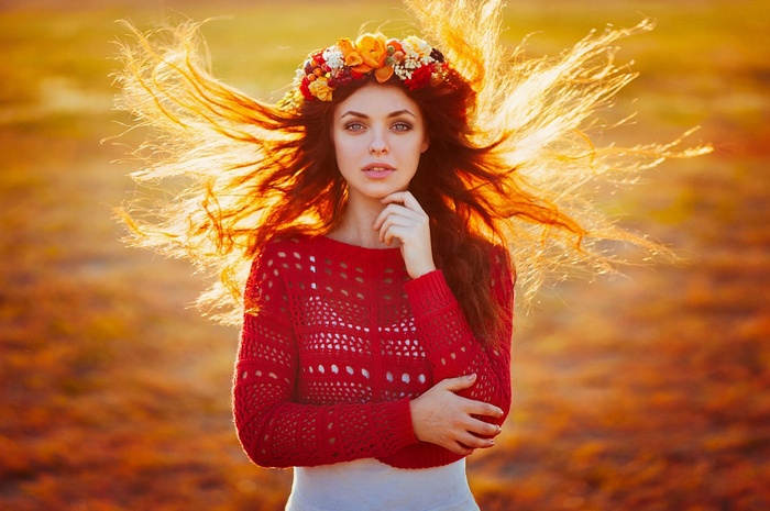 Ann Nevreva with flower crown in windy field