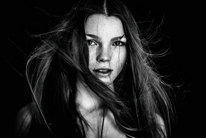 Monochrome portrait of a woman with windblown hair