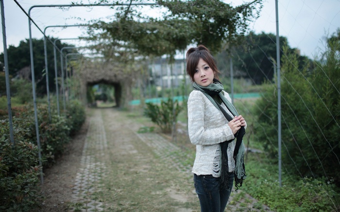 Mikako Zhang Kaijie in a white sweater and scarf