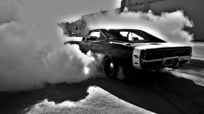 Black Dodge Charger doing a burnout