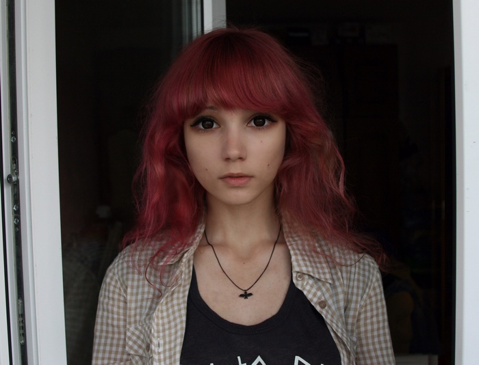 Alice Johnson with red hair looking at viewer