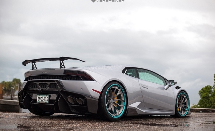 Silver Lamborghini Aventador with a large rear spoiler
