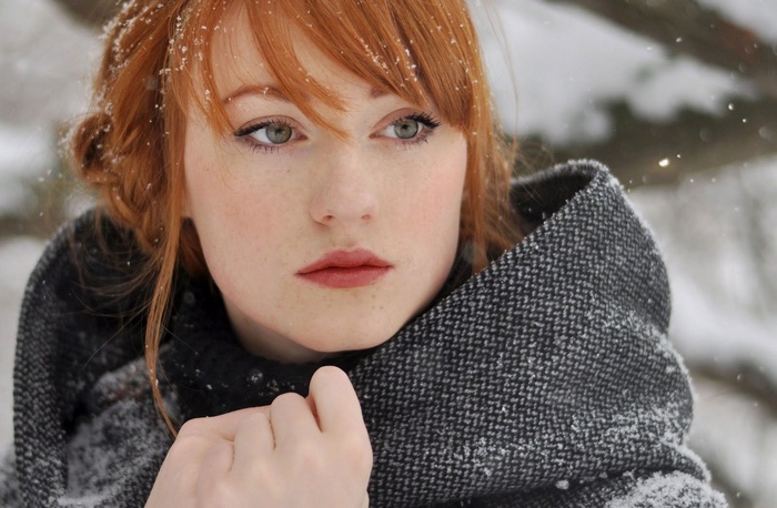 Alina Kovalenko in the snow wearing a grey coat