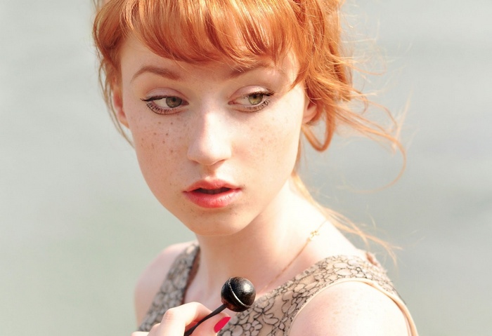 Alina Kovalenko with a lollipop and freckles