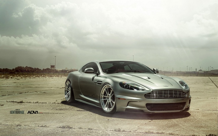 Silver Aston Martin DBS on a concrete surface