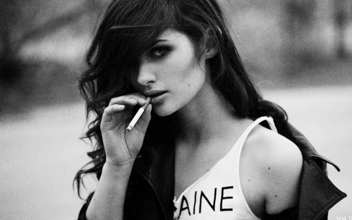 Woman smoking cigarette, monochrome portrait