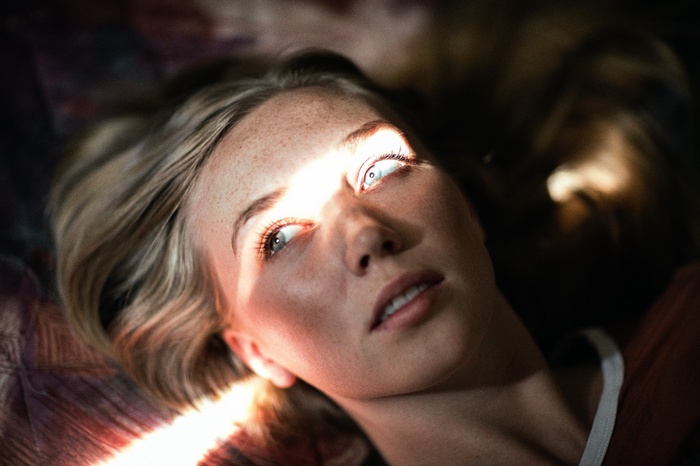 Woman with sunlight on her face