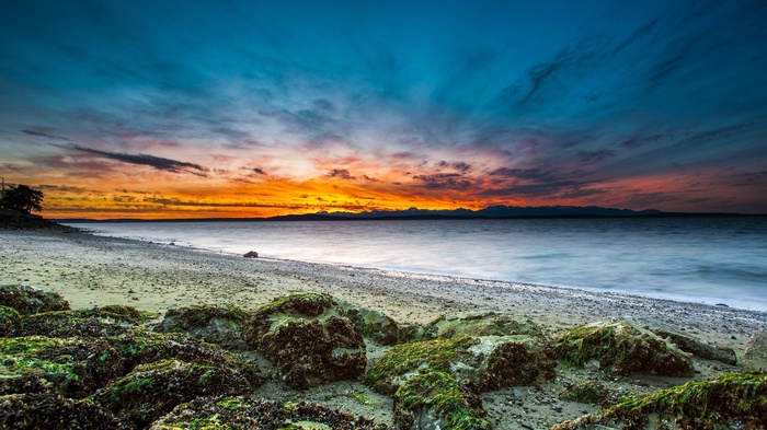 Beach with sunset sky and ocean