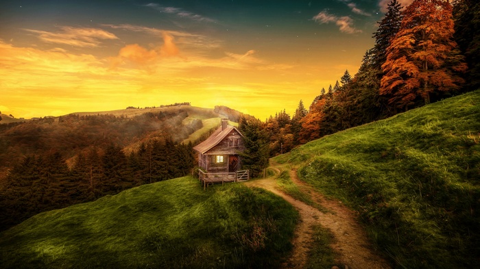 Cabin in the woods at sunset