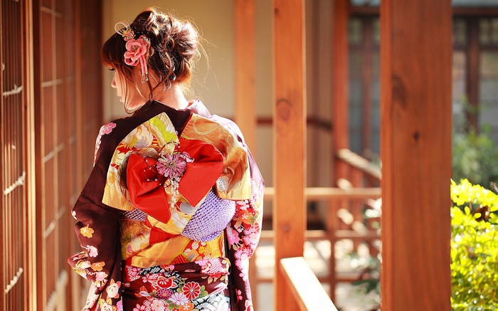 Woman in traditional Japanese kimono with floral patterns