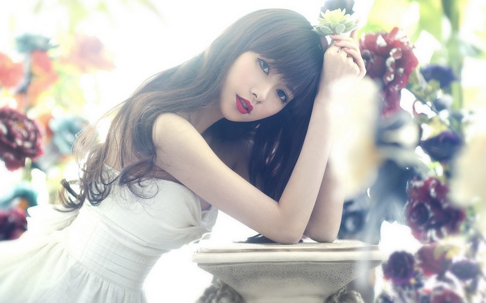 Asian woman with long hair and red lips