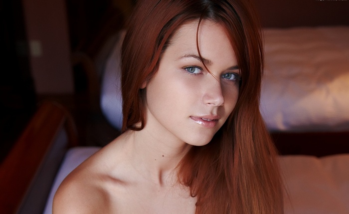 Kamila Hermanova with long red hair and blue eyes
