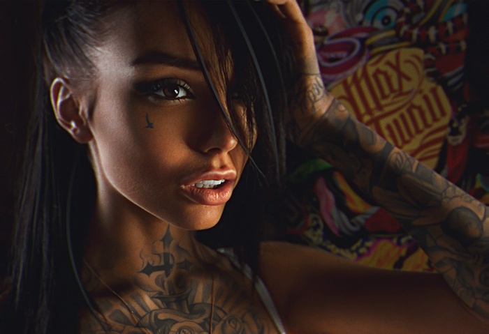 Woman with tattoos and Max Twain shirt