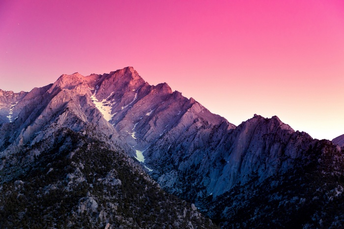 Mountain range at sunset with pink sky