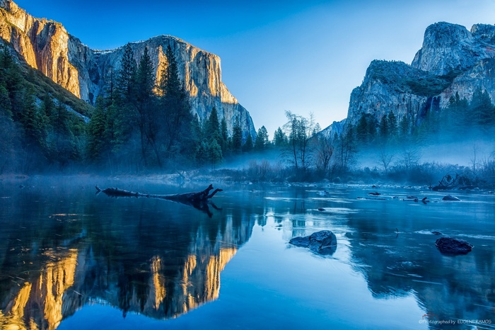 Misty river reflecting mountains in Yosemite National Park