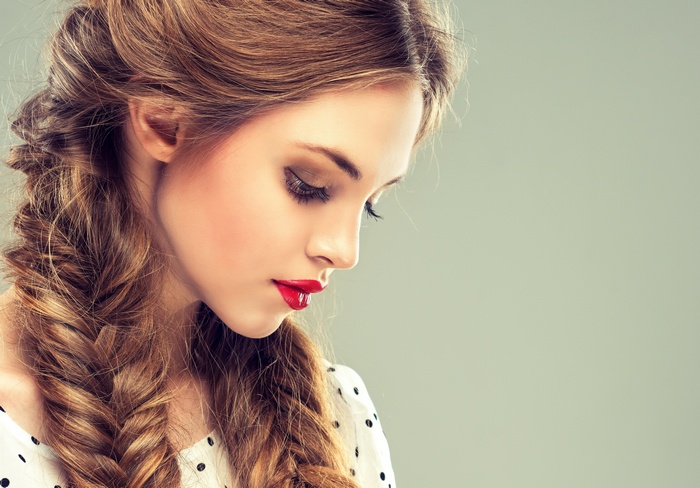 Woman with braided hair and red lipstick