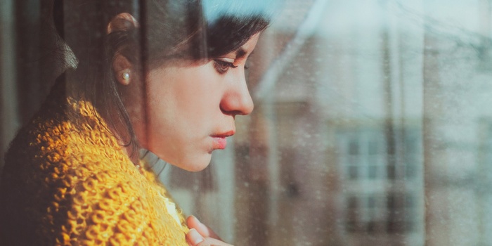Woman looking out a window