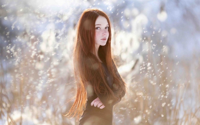 Redhead woman with freckles in winter